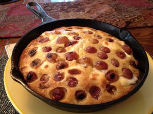 Lump Crab Grape Cornbread in a Cast Iron Skillet on a Yellow Plate